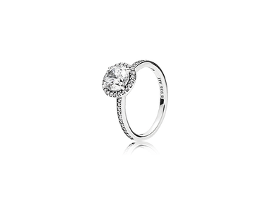 Halo-style silver engagement ring with round center stone and pavé accents on band