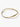 Minimalist gold bangle bracelet with irregular shape on white background
