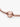 Rose gold snake chain bracelet with round engraved clasp, close-up jewelry photo