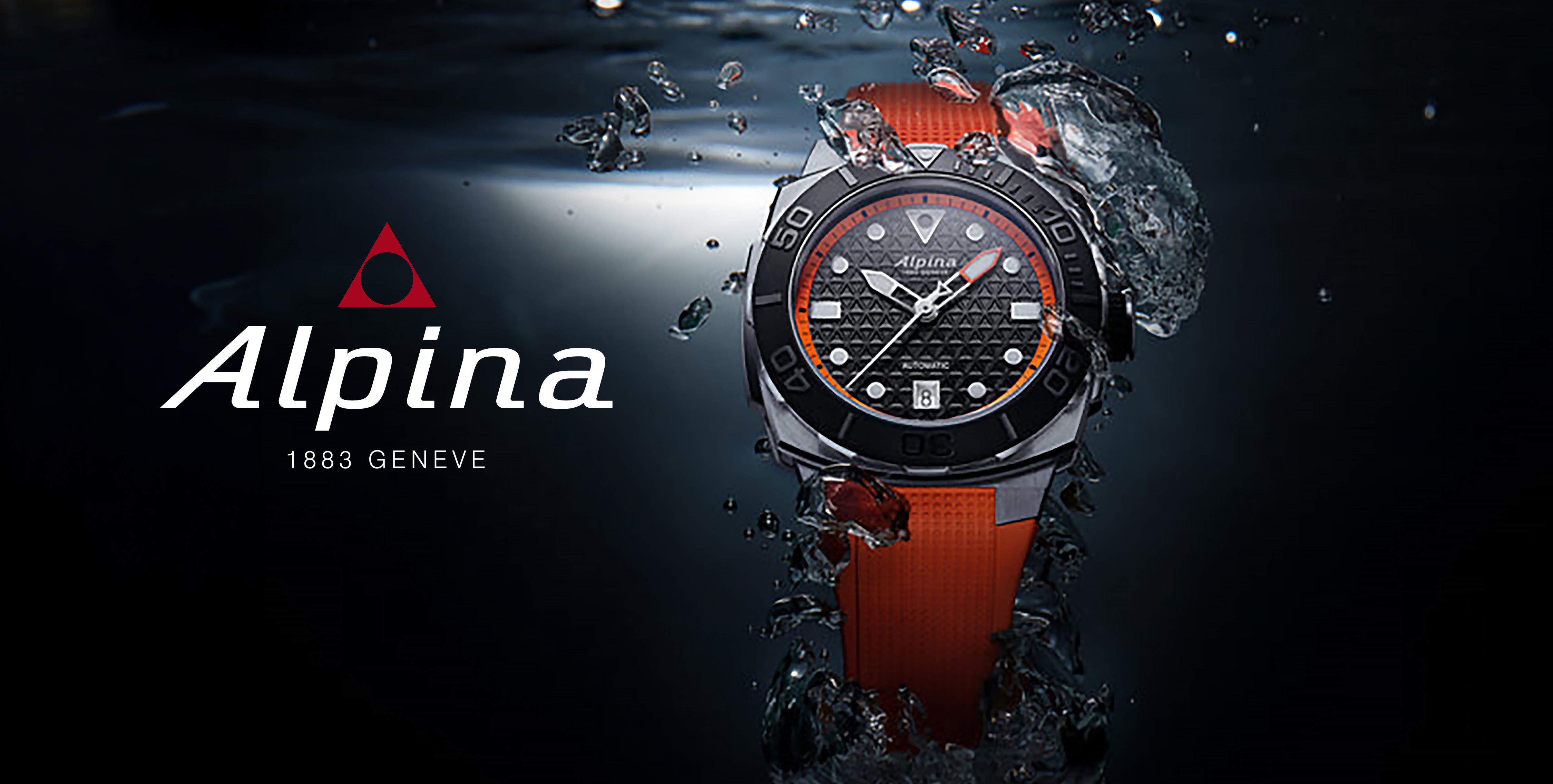 Alpina dive watch with black and orange strap underwater with water splashes