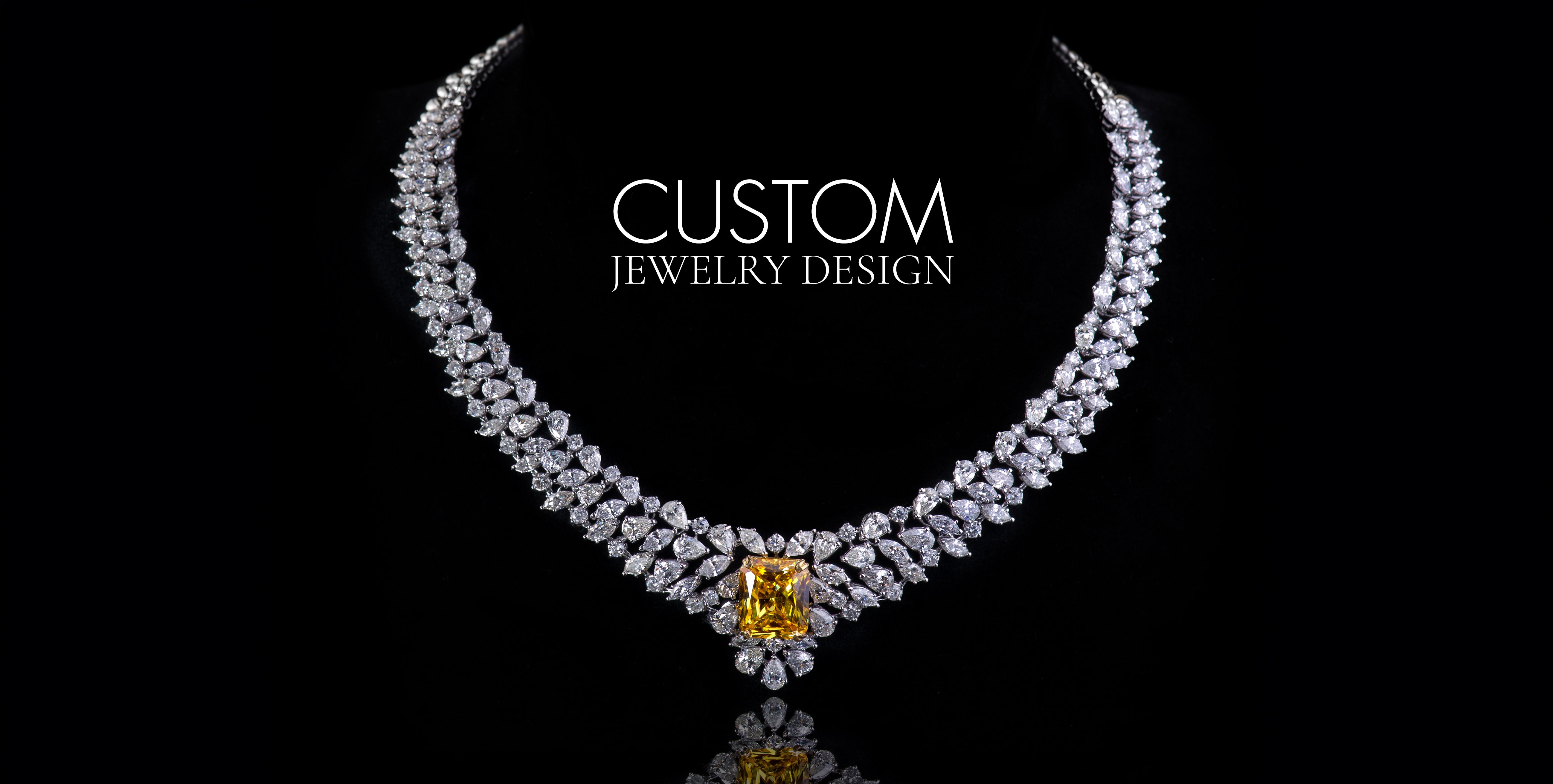 Luxury custom diamond necklace with large yellow gemstone centerpiece on black background