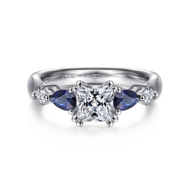 Princess cut diamond and sapphire engagement ring in white gold with side stones