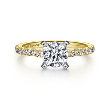 Yellow gold diamond engagement ring with round solitaire and pavé diamond band