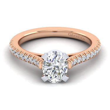 Oval diamond engagement ring with rose gold band and pavé diamond accents