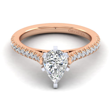 Rose gold engagement ring with pear shaped diamond center and diamond accented band