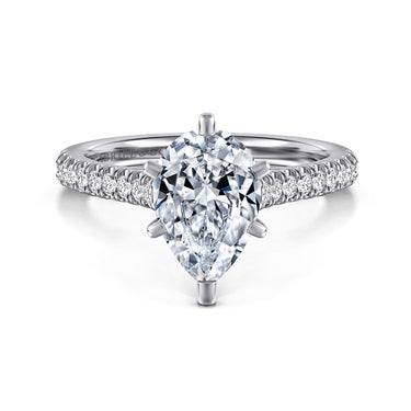 Pear-shaped diamond engagement ring with pavé diamond band in white gold setting