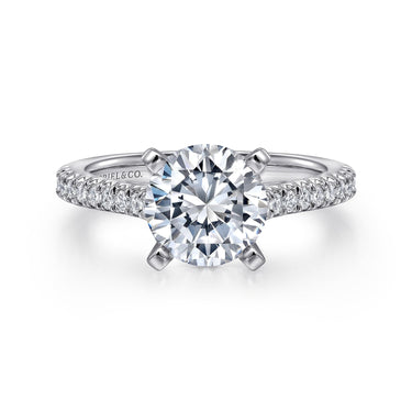 Round solitaire diamond engagement ring with diamond pavé band in white gold