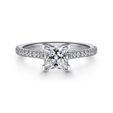 Princess cut diamond engagement ring with pavé band in white gold, elegant jewelry