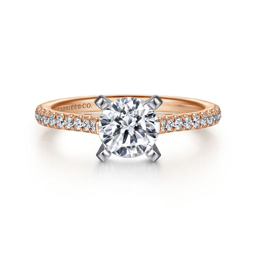 Rose gold engagement ring with round brilliant cut diamond and pavé band