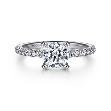 Round cut diamond engagement ring with pavé band in white gold