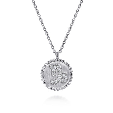 Silver Capricorn zodiac pendant necklace with diamond accents on a chain