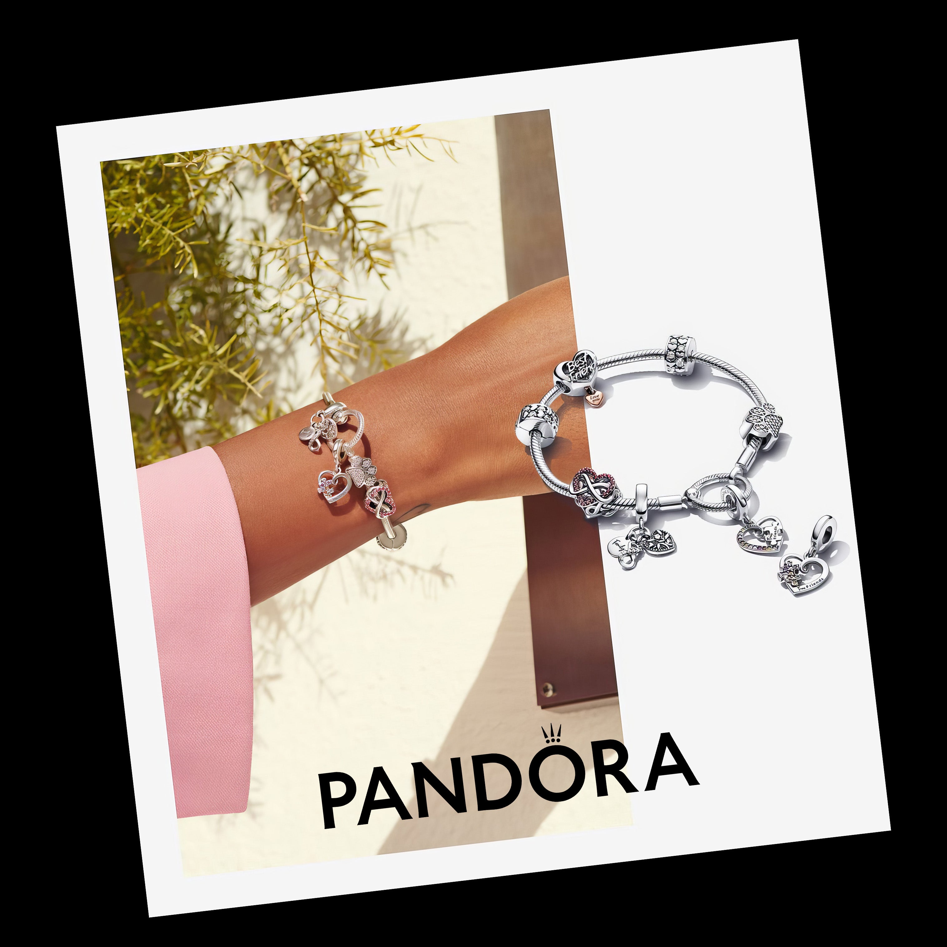 Silver Pandora charm bracelet with heart-shaped charms on wrist, elegant jewelry display