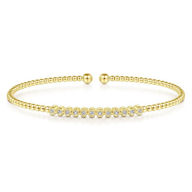 Gold beaded cuff bracelet with a row of round diamonds, elegant fine jewelry.