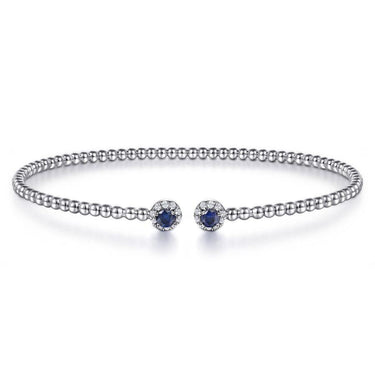 Sterling silver beaded open bangle with two blue sapphire and diamond halo accents