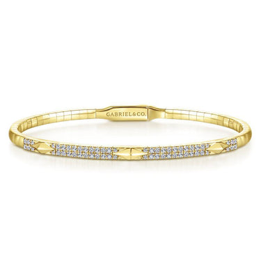Yellow gold diamond bangle bracelet with pavé-set stones and geometric accents on white background