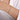 Slim gold bangle bracelet with sparkling details on a woman's wrist
