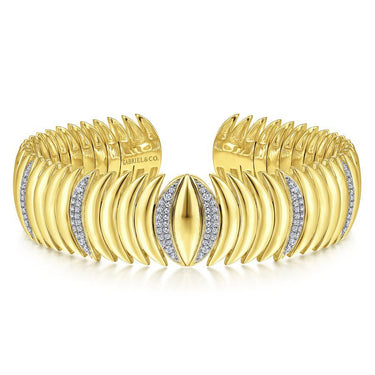 Wide gold cuff bracelet with marquise-shaped diamond accents and sculpted links