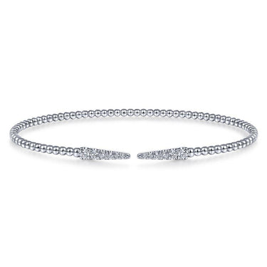 White gold beaded cuff bracelet with pavé diamond-accented pointed ends on white background