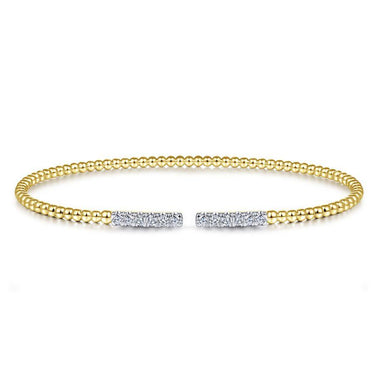 Yellow gold beaded cuff bracelet with pavé diamond accents on open ends, elegant design