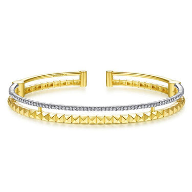 Yellow gold cuff bracelet with pavé diamonds and pyramid stud accents, fashion jewelry