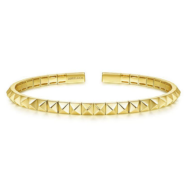 Yellow gold pyramid stud cuff bracelet with open design and polished finish
