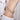 Gold diamond bracelet with heart-shaped accents worn on wrist