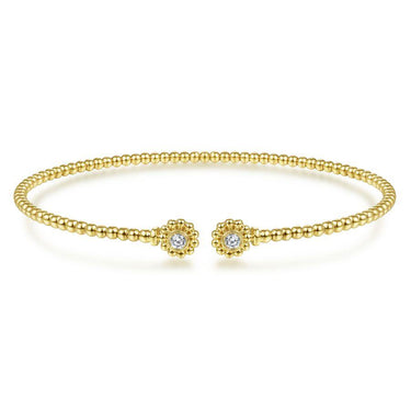 Gold beaded cuff bracelet with two floral diamond accents, elegant fashion jewelry