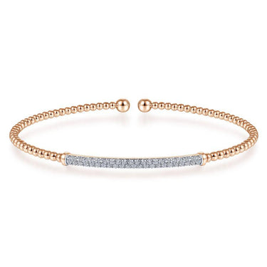 Rose gold beaded cuff bracelet with pavé diamond bar on white background