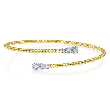 Yellow gold beaded cuff bracelet with diamond accents on open ends, elegant jewelry