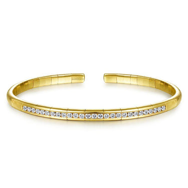Yellow gold cuff bracelet with row of round diamonds, elegant fine jewelry