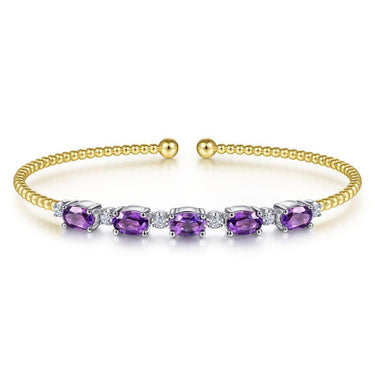 Yellow gold beaded cuff bracelet with purple amethyst gemstones and diamond accents.