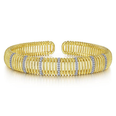 Gold cuff bracelet with twisted rope design and diamond-accented vertical bands