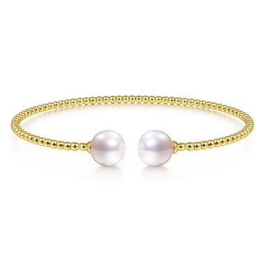 Gold beaded open cuff bracelet with two white pearls on each end, elegant jewelry
