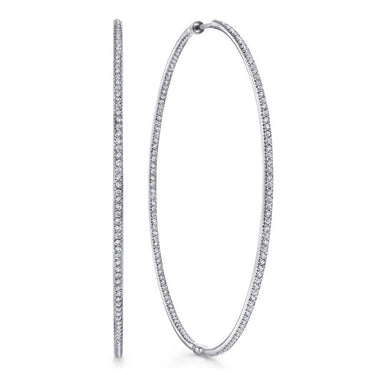 Large white gold hoop earrings with pavé-set diamonds, fashion jewelry product photo