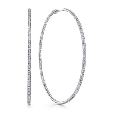 Large white gold hoop earrings with pavé-set diamonds, fine jewelry on white background