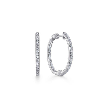 White gold hoop earrings with pavé diamonds on white background