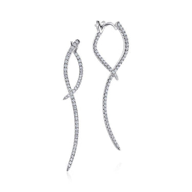 Elegant white gold curved drop earrings with sparkling pavé diamonds on a white background