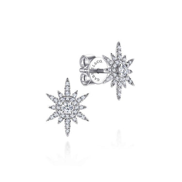 White gold diamond starburst stud earrings with a sparkling pavé setting on white background