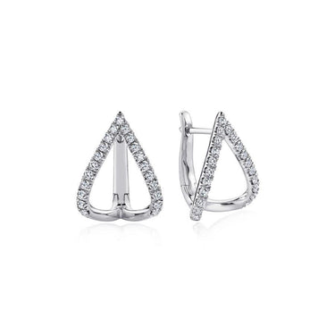 Pair of teardrop-shaped white gold earrings with pavé-set diamonds on white background