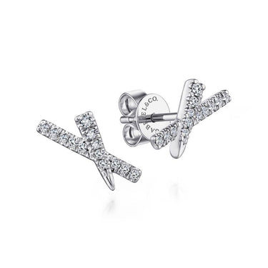 White gold diamond X-shaped stud earrings on white background