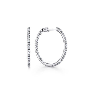 White gold diamond hoop earrings with pavé setting on a white background