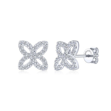 Diamond flower stud earrings in white gold with open petal design on white background