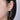 Large diamond hoop earring in white gold worn on ear, bridal and fashion jewelry