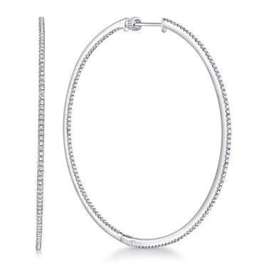 Large white gold diamond hoop earrings with pavé-set sparkling stones on white background
