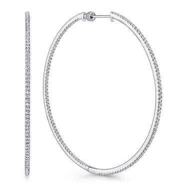 White gold large diamond hoop earrings with pave setting on a white background