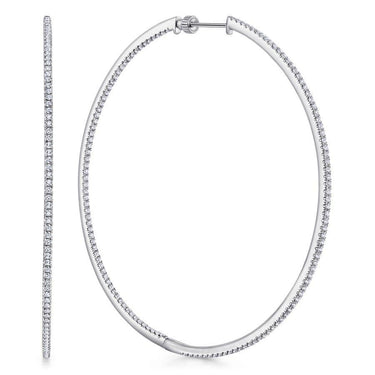 Large white gold hoop earrings with pavé diamond accents, displayed on white background