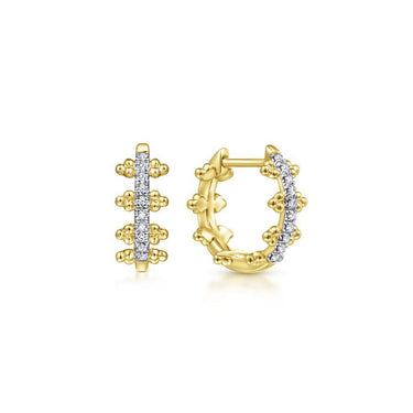 Yellow gold hoop earrings with diamond accents and beaded detailing on white background