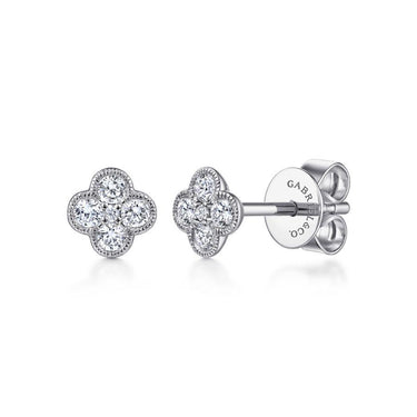 White gold floral stud earrings with round diamonds in a clover shape on white background