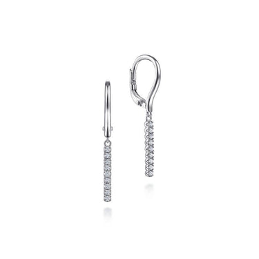 White gold drop earrings with vertical row of round diamonds on white background