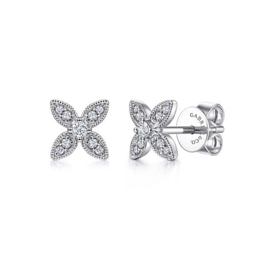 White gold diamond floral stud earrings with milgrain detailing on a white background